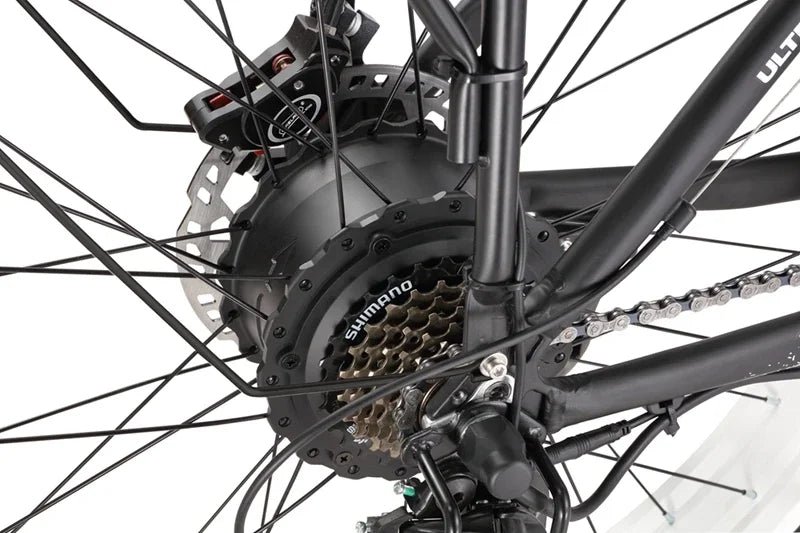 Close-up of KETELES K800 electric mountain bicycle's Shimano gear system with hydraulic disc brake.