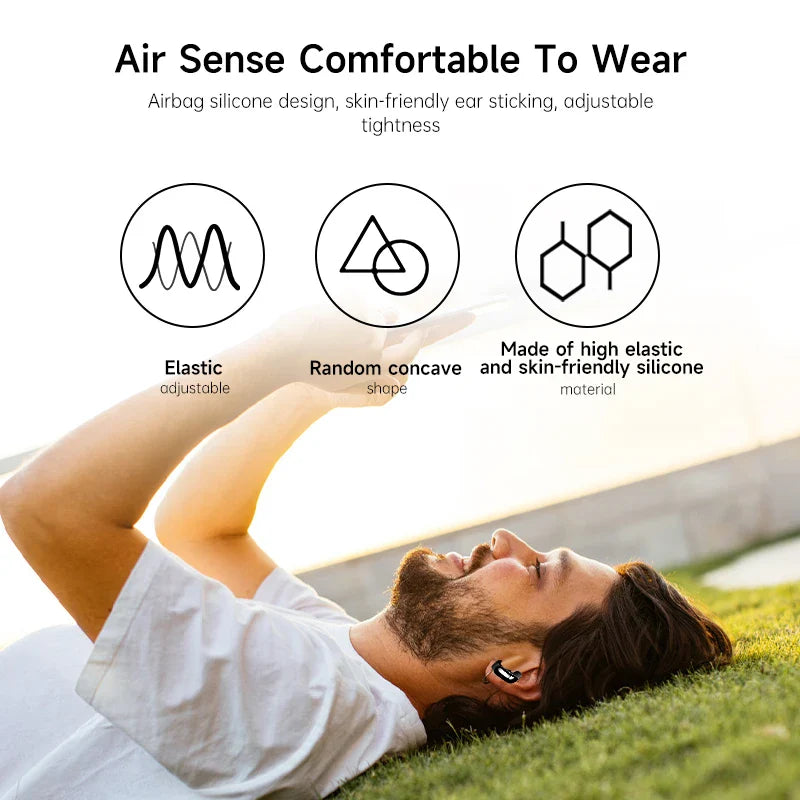 Wireless Bluetooth 5.3 earbuds with active noise cancellation, shown in use while lying on grass.