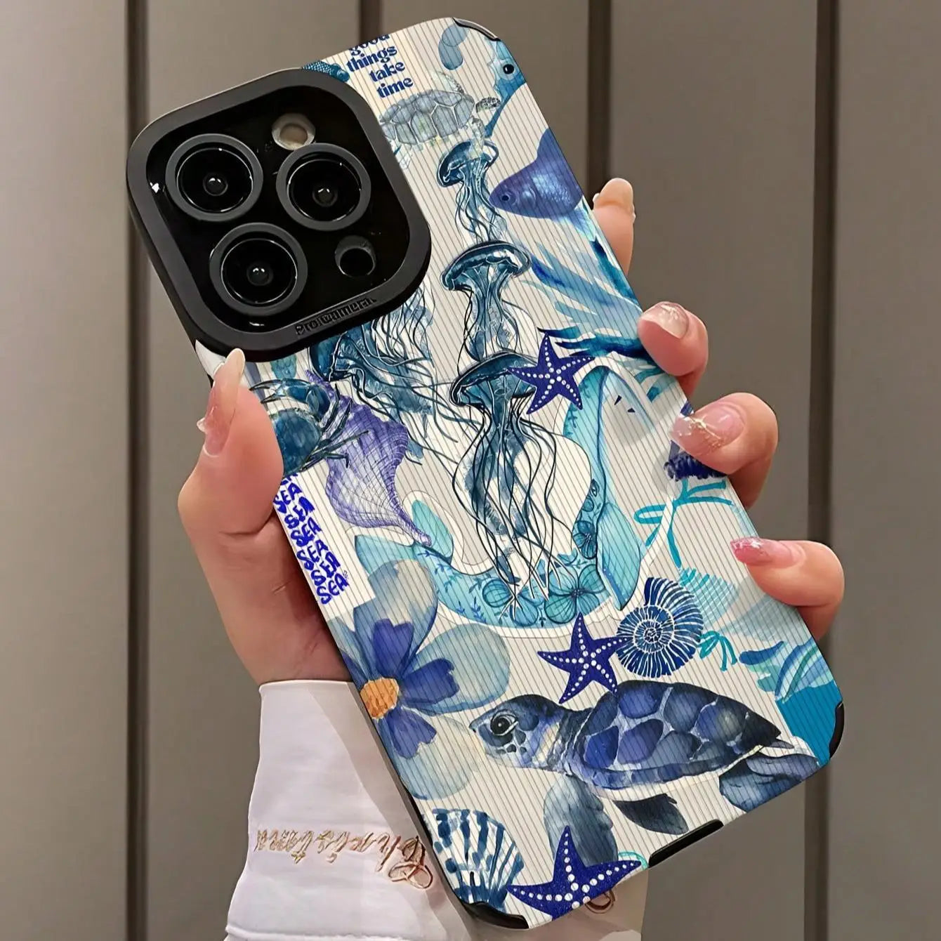 Fashion Ocean Theme phone case compatible with iPhone models, featuring blue oceanic designs with starfish and sea creatures.