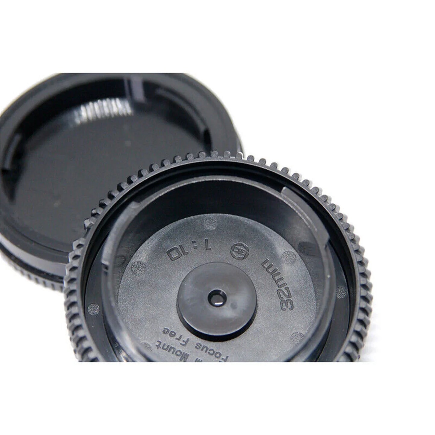 Close-up of a Focus Free Pancake Biscuit Lens for Sony E-Mount mirrorless cameras with 150mm focal length and automatic focus mode.