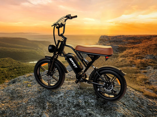 AMYET V9-G60 black electric bike with 1000W motor and 20-inch tires on rocky terrain at sunset