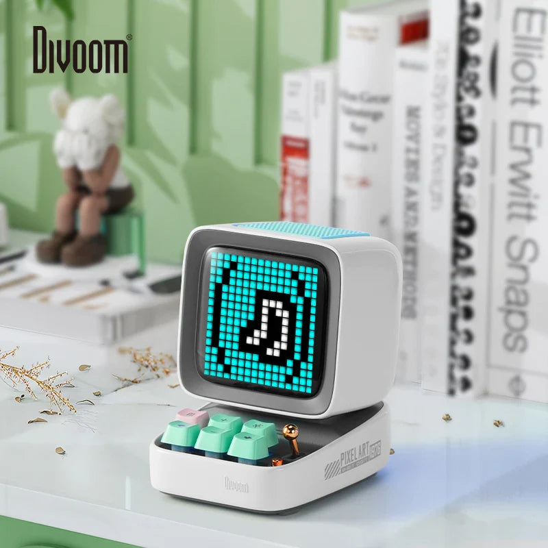 Divoom Ditoo-Pro portable Bluetooth speaker with pixel art display, featuring retro gaming design and alarm clock function in a stylish white finish.