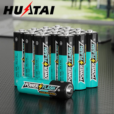 HUATAI PowerFlash AA 100 Pack Alkaline Batteries on a table.